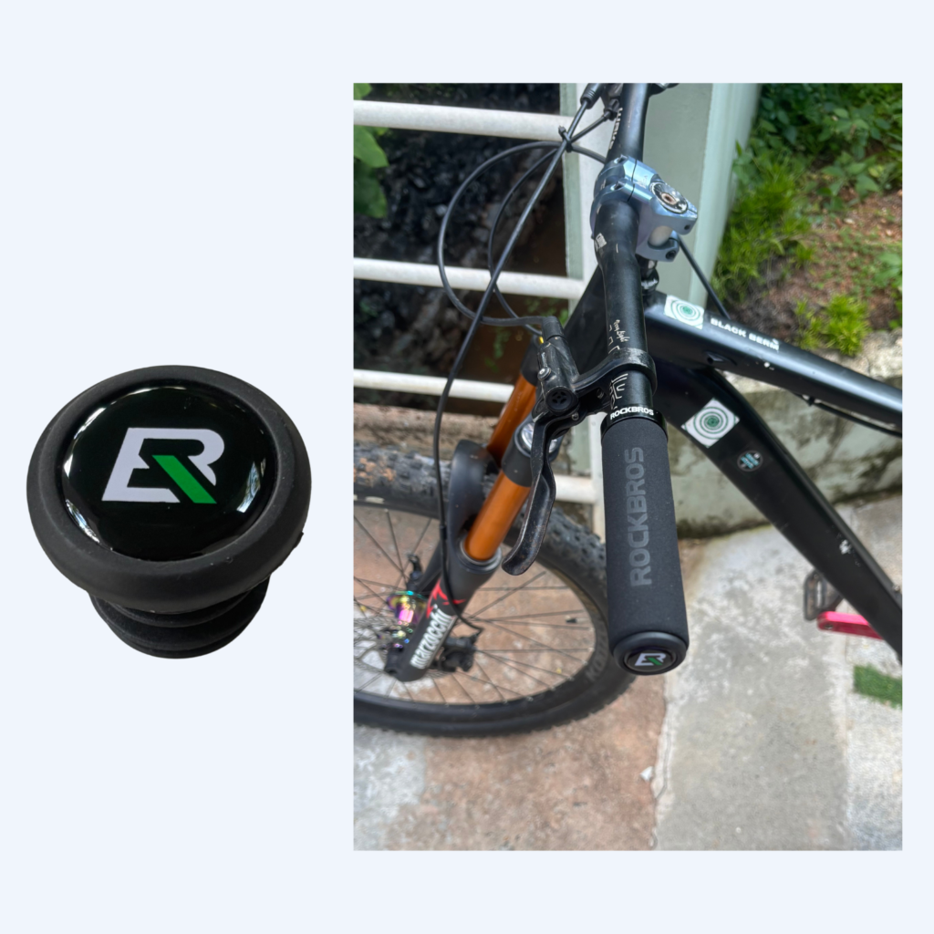 Dustproof PVC bar ends installed on a mountain bike handlebar to protect Rockbros grips, a cheap MTB accessory in India.